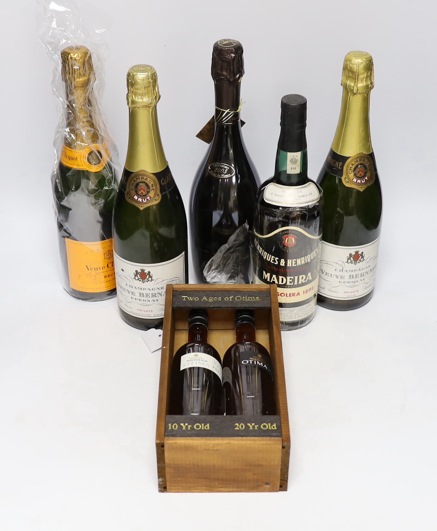 A bottle of Champagne Colin grand cru, Veuve Clienquot, two bottles of Champagne Veuve Bernard, a bottle of Madeira “Boal Solera 1898”, two small bottles cased of Two Ages of Otima, 10year old and 20 year old